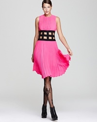 Pretty pink pleats meet a contrast cutout waist in a BCBGMAXAZRIA dress that's one cut above the rest. Pretty pink pleats meet a contrast cutout waist in a BCBGMAXAZRIA dress that's one cut above the rest.