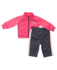 Sporty and sweet, this Nike track suit will have your little one ready to work it. Sporty and sweet, this Nike track suit will have your little one ready to work it.