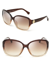 Whether you're in a sarong or sweater, these classically oversized sunnies from MICHAEL Michael Kors tie together any look. Whether you're in a sarong or sweater, these classically oversized sunnies from MICHAEL Michael Kors tie together any look.
