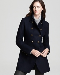 Military-inspiration is front and center on this DKNY double-breasted coat, boasting brass buttons at the collar and front for an authentic touch. Military-inspiration is front and center on this DKNY double-breasted coat, boasting brass buttons at the collar and front for an authentic touch.