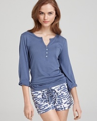 A classic long sleeve henley with a partial button front and ribbed trim. A perfect match for your favorite pajama pants. A classic long sleeve henley with a partial button front and ribbed trim. A perfect match for your favorite pajama pants.