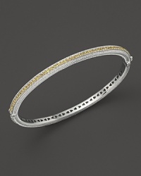 Yellow sapphires stud a sterling silver bangle from Judith Ripka. Yellow sapphires stud a sterling silver bangle from Judith Ripka.