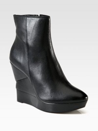 A timeless leather favorite resting on a sculpted wooden wedge. Wooden wedge, 4½ (115mm)Wooden platform, 1 (25mm)Compares to a 3½ heel (90mm)Leather upperSide zipLeather liningRubber solePadded insoleImported A timeless leather favorite resting on a sculpted wooden wedge. Wooden wedge, 4½ (115mm)Wooden platform, 1 (25mm)Compares to a 3½ heel (90mm)Leather upperSide zipLeather liningRubber solePadded insoleImported