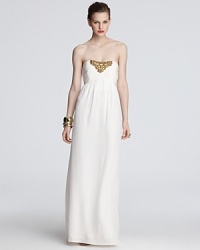 Golden beads at the bodice lend gilded luxury to this Shoshonna strapless gown. Golden beads at the bodice lend gilded luxury to this Shoshonna strapless gown.