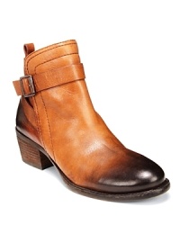With burnished, antique-look leather, ankle buckles and stacked, cowgirl-style heels, these VINCE CAMUTO booties take a fresh stance on the Western booties trend. With burnished, antique-look leather, ankle buckles and stacked, cowgirl-style heels, these VINCE CAMUTO booties take a fresh stance on the Western booties trend.