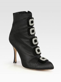 Chic ankle boot silhouette of rich satin with luminous Swarovski crystals. Self-covered heel, 4¼ (110mm)Satin upper with Swarovski crystalsSide zipLeather lining and solePadded insoleMade in Italy Chic ankle boot silhouette of rich satin with luminous Swarovski crystals. Self-covered heel, 4¼ (110mm)Satin upper with Swarovski crystalsSide zipLeather lining and solePadded insoleMade in Italy