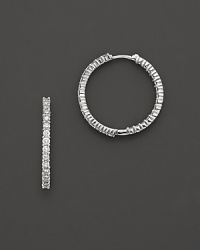 Inside/outside diamond hoop earrings; with signature ruby accent. Post closure for pierced ears. Designed by Roberto Coin. Inside/outside diamond hoop earrings; with signature ruby accent. Post closure for pierced ears. Designed by Roberto Coin.
