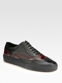 Classic brogue paneling and perforations are elevated and enhanced in bi-colored, polished leather for a contemporary look.Leather upperLeather liningPadded insoleRubber soleMade in Italy Classic brogue paneling and perforations are elevated and enhanced in bi-colored, polished leather for a contemporary look.Leather upperLeather liningPadded insoleRubber soleMade in Italy