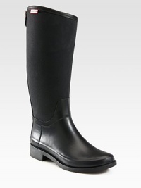A twist on Hunter's classic rain boot, with an equestrian-style silhouette, nylon shaft and gleaming goldtone hardware.Rubber heel, 1¼ (30mm)Shaft, 14¾Leg circumference, 14Rubber and nylon upperBack zip with snap closureNylon liningRubber solePadded insoleImported A twist on Hunter's classic rain boot, with an equestrian-style silhouette, nylon shaft and gleaming goldtone hardware.Rubber heel, 1¼ (30mm)Shaft, 14¾Leg circumference, 14Rubber and nylon upperBack zip with snap closureNylon liningRubber solePadded insoleImported
