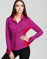 Go from color blocking to color shocking in this Elie Tahari blouse, finished with an ornately printed back for a statement approach to the classic shirt. Go from color blocking to color shocking in this Elie Tahari blouse, finished with an ornately printed back for a statement approach to the classic shirt.
