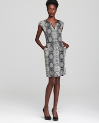 Take your work look up a notch with a snake-print Rebecca Taylor dress flaunting subtle front pleats and a back exposed zip with leather pull tab an edgy finishing touch. Take your work look up a notch with a snake-print Rebecca Taylor dress flaunting subtle front pleats and a back exposed zip with leather pull tab an edgy finishing touch.