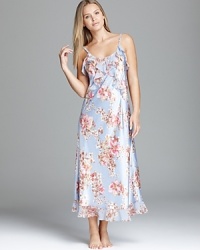 A floral print and ruffled trim lend relaxed elegance to this elegant nightgown from Oscar de la Renta Pink Label. A floral print and ruffled trim lend relaxed elegance to this elegant nightgown from Oscar de la Renta Pink Label.