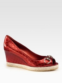 A signature horsebit detail adorns this logo-embossed metallic leather wedge with a classic peep toe and textured rope edging. Self-covered wedge with rope edging, 2¼Covered platform, ¾ (20mm)Compares to a 1½ heel (40mm)Metallic leather upperPeep toeLeather liningRubber solePadded insoleMade in Italy A signature horsebit detail adorns this logo-embossed metallic leather wedge with a classic peep toe and textured rope edging. Self-covered wedge with rope edging, 2¼Covered platform, ¾ (20mm)Compares to a 1½ heel (40mm)Metallic leather upperPeep toeLeather liningRubber solePadded insoleMade in Italy