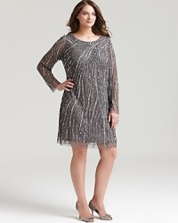 Elaborate beading lends evening sparkle to Aidan Mattox's embellished dress, rich in sophisticated glamour.