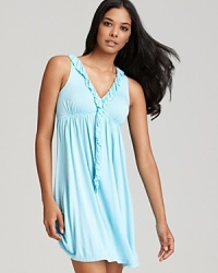 Exude elegance in a flowy chemise with ruffle trim along a V-neckline and down center front. Exude elegance in a flowy chemise with ruffle trim along a V-neckline and down center front.