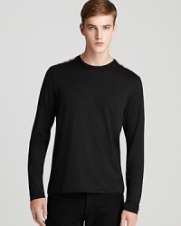 The check panel at the shoulder gives this soft cotton tee designer flair, a signature accent from the always current Burberry. The check panel at the shoulder gives this soft cotton tee designer flair, a signature accent from the always current Burberry.