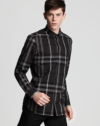Crisp cotton showcases a classic button front shirt from Burberry London. Crisp cotton showcases a classic button front shirt from Burberry London.