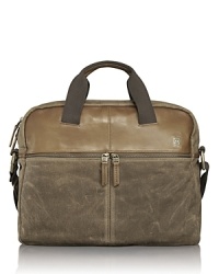 The Forge collection is rendered in wax-coated cotton canvas with leather trim accents and antiqued brass hardware for rugged appeal and utilitarian functionality. With vintage inspiration and artisan detailing, each bag is made to last and performs well in numerous environments. The soft, unstructured portfolio bag offers excellent organization pockets that store all your everyday essentials. The Forge collection is rendered in wax-coated cotton canvas with leather trim accents and antiqued brass hardware for rugged appeal and utilitarian functionality. With vintage inspiration and artisan detailing, each bag is made to last and performs well in numerous environments. The soft, unstructured portfolio bag offers excellent organization pockets that store all your everyday essentials.