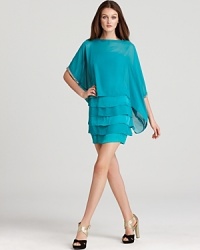 Featuring a tiered dress with a billowy overlay, this vibrantly hued Laundry by Shelli Segal dress moves with elegance on and off the dance floor. Featuring a tiered dress with a billowy overlay, this vibrantly hued Laundry by Shelli Segal dress moves with elegance on and off the dance floor.