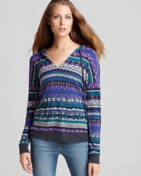 This Splendid thermal knit hoodie is just as comfortable as it is on-trend. Dress up the eclectic print by adding a few layered necklaces. This Splendid thermal knit hoodie is just as comfortable as it is on-trend. Dress up the eclectic print by adding a few layered necklaces.