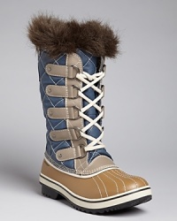 A stylishly cozy burst of faux fur and chic, quilted nylon make winter's blasts a little less daunting; by Sorel. A stylishly cozy burst of faux fur and chic, quilted nylon make winter's blasts a little less daunting; by Sorel.