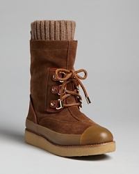 So cozy: Tory Burch brings style into adorable weekend standbys, boots with scrunchy sock linings and cute rubber cap toes. So cozy: Tory Burch brings style into adorable weekend standbys, boots with scrunchy sock linings and cute rubber cap toes.