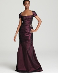 This David Meister gown exudes timeless glamour--allover pleating lends a dramatic look, while a beaded detail lends subtle sparkle. This David Meister gown exudes timeless glamour--allover pleating lends a dramatic look, while a beaded detail lends subtle sparkle.