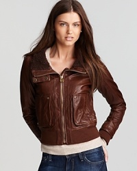 Slim-structured and richly hued, this KORS Michael KORS leather jacket is prepped for an everyday-chic look with gold washer accents, ribbed trim and tonal stitching details. Raise the wide lined collar when the wind picks up. Slim-structured and richly hued, this KORS Michael KORS leather jacket is prepped for an everyday-chic look with gold washer accents, ribbed trim and tonal stitching details. Raise the wide lined collar when the wind picks up.