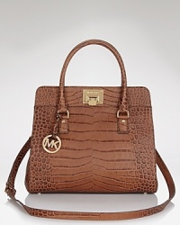 The perfectly sized satchel from MICHAEL Michael Kors complete with gleaming goldtone logo-embossed turnlock closure. The perfectly sized satchel from MICHAEL Michael Kors complete with gleaming goldtone logo-embossed turnlock closure.