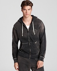 The rugged distressed look lends a harder edge to this laid-back hoodie design from True Religion, an easy grab-and-go option that's always there when you need it. The rugged distressed look lends a harder edge to this laid-back hoodie design from True Religion, an easy grab-and-go option that's always there when you need it.