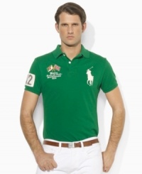 A trim-fitting polo shirt in breathable cotton mesh is finished with bold country details and Ralph Lauren's signature Big Pony. A trim-fitting polo shirt in breathable cotton mesh is finished with bold country details and Ralph Lauren's signature Big Pony.