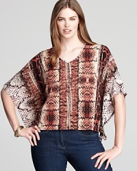 With an exotic snakeskin print, this Karen Kane Plus top enlivens your everyday. Add depth to the desert palette with flashes of bronze for untamed glamour. With an exotic snakeskin print, this Karen Kane Plus top enlivens your everyday. Add depth to the desert palette with flashes of bronze for untamed glamour.