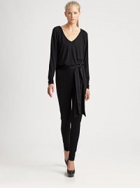 A soft, draped jersey jumpsuit is offset with a tonal contrast silk tie at waist.V-neckShirred neck and shouldersLong sleeveElastic waistSilk tie beltInseam, about 31RayonHand washImported Model shown is 5'11 (180cm) wearing US size Small.This style runs true to size. We recommend ordering your usual size for a standard fit. A soft, draped jersey jumpsuit is offset with a tonal contrast silk tie at waist.V-neckShirred neck and shouldersLong sleeveElastic waistSilk tie beltInseam, about 31RayonHand washImported Model shown is 5'11 (180cm) wearing US size Small.This style runs true to size. We recommend ordering your usual size for a standard fit.