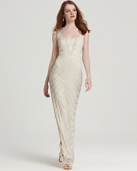 Intricately bedecked in shimmering beads, this Aidan Mattox gown exudes vintage-inspired glamour. Intricately bedecked in shimmering beads, this Aidan Mattox gown exudes vintage-inspired glamour.