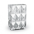 Inspired by a celebrated design of George Chevalier in the 1930s, Thomas Bastide's diamond-cut vase featuring grand pyramids is a striking way to showcase your favorite blooms.