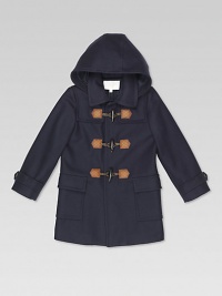 A striking, button-front Oltremare felt coat with hood, leather and horn toggle buttons with guccissima leather detail, front pockets and GG lining.HoodedShirt collarLong sleeves with belted button cuffsStorm flapsLeather and horn toggle button placketFlap patch pocketsBack ventTone-on-tone micros GG lining70% wool/20% polyamide/10% cashmereDry cleanMade in Italy Please note: Number of buttons may vary depending on size ordered. A striking, button-front Oltremare felt coat with hood, leather and horn toggle buttons with guccissima leather detail, front pockets and GG lining.HoodedShirt collarLong sleeves with belted button cuffsStorm flapsLeather and horn toggle button placketFlap patch pocketsBack ventTone-on-tone micros GG lining70% wool/20% polyamide/10% cashmereDry cleanMade in Italy Please note: Number of buttons may vary depending on size ordered.