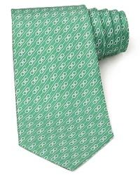 Signature Gancini logos are banded by stripes for an alluring pattern on this handsome Salvatore Ferragamo silk tie. Signature Gancini logos are banded by stripes for an alluring pattern on this handsome Salvatore Ferragamo silk tie.