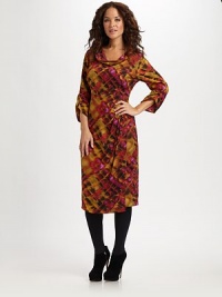 A bold print and a fitted silhouette add up to a very flattering look. Cowlneck Three-quarter ruched sleeves Side zip closure Empire waist with pleat detail Front princess seams Back hip darts About 26 from natural waist 95% silk/5% elastane Dry clean Imported A bold print and a fitted silhouette add up to a very flattering look. Cowlneck Three-quarter ruched sleeves Side zip closure Empire waist with pleat detail Front princess seams Back hip darts About 26 from natural waist 95% silk/5% elastane Dry clean Imported