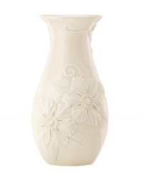 Teeming with fresh blooms, the Floral Fields vase from Lenox exudes a serene, understated elegance. A simple silhouette in creamy ivory porcelain balances elaborate sculpted detail. Teeming with fresh blooms, the Floral Fields vase from Lenox exudes a serene, understated elegance. A simple silhouette in creamy ivory porcelain balances elaborate sculpted detail.