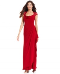 Xscape's petite gown features an elegant, slim silhouette and gorgeous lace cap sleeves as a finishing touch. Xscape's petite gown features an elegant, slim silhouette and gorgeous lace cap sleeves as a finishing touch.