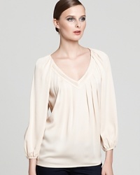 Simple yet elegant, this peasant-style DIANE von FURSTENBERG top, neutralizes basic black or dark wash skinnies. Simple yet elegant, this peasant-style DIANE von FURSTENBERG top, neutralizes basic black or dark wash skinnies.
