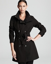 Classically tailored and forever chic, this Calvin Klein trench coat lends impeccable polish to your outerwear repertoire. Classically tailored and forever chic, this Calvin Klein trench coat lends impeccable polish to your outerwear repertoire.