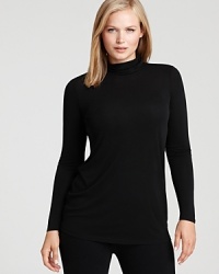 Rendered in sumptuous silk, this Eileen Fisher Plus turtleneck lends luxe appeal to your laidback style with a classic silhouette in a chic shade.