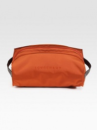 A suitcase essential, crafted in lightweight nylon with tonal logo detail.Zip closureSide handlesFully linedPolyamide10W x 6H x 7DImported A suitcase essential, crafted in lightweight nylon with tonal logo detail.Zip closureSide handlesFully linedPolyamide10W x 6H x 7DImported