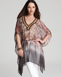 Embark on a quest to traveler-chic in this XCVI tunic blazing with mixed textures, tones, and prints. Play up the global aesthetic with layered beads and stacked bangles. Embark on a quest to traveler-chic in this XCVI tunic blazing with mixed textures, tones, and prints. Play up the global aesthetic with layered beads and stacked bangles.