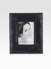 A patchwork of genuine snakeskin makes this frame especially distinctive for displaying treasured photos.Soft, padded designShadowbox effectSnakeskinElegantly packaged for gift-givingImportedDIMENSION INFORMATION4 X 6 5 X 7 A patchwork of genuine snakeskin makes this frame especially distinctive for displaying treasured photos.Soft, padded designShadowbox effectSnakeskinElegantly packaged for gift-givingImportedDIMENSION INFORMATION4 X 6 5 X 7