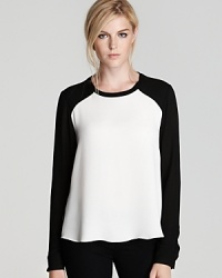 Sporty chic gets elevated with a sheer silky take on the raglan-sleeve tee by Rebecca Taylor boasting colorblocked sleeves, side slits and an on-trend hi-low hem. Sporty chic gets elevated with a sheer silky take on the raglan-sleeve tee by Rebecca Taylor boasting colorblocked sleeves, side slits and an on-trend hi-low hem.