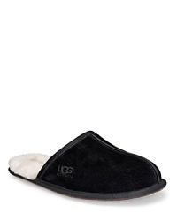 Suede mule style slippers, fully lined in sheepskin. Genuine sheepskin sockliner that naturally wicks moisture away and keeps your feet dry. Lightweight, sueded bottom with embossed logo. Suede mule style slippers, fully lined in sheepskin. Genuine sheepskin sockliner that naturally wicks moisture away and keeps your feet dry. Lightweight, sueded bottom with embossed logo.