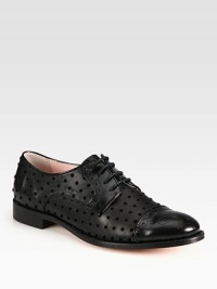 Classically styled leather oxford fashioned with velour polka dots and patent leather trim. Stacked heel, 1 (25mm)Leather, patent leather and velour upperLeather lining and solePadded insoleMade in Italy Classically styled leather oxford fashioned with velour polka dots and patent leather trim. Stacked heel, 1 (25mm)Leather, patent leather and velour upperLeather lining and solePadded insoleMade in Italy