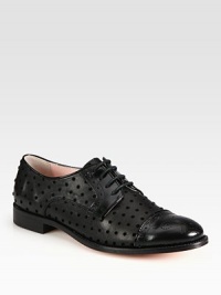 Classically styled leather oxford fashioned with velour polka dots and patent leather trim. Stacked heel, 1 (25mm)Leather, patent leather and velour upperLeather lining and solePadded insoleMade in Italy